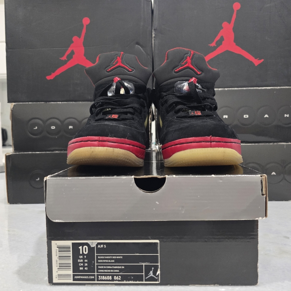 This is a pair of Air Jordan Fusion 5 "Varsity Red" sneakers. 